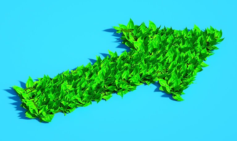 Digital generated image of arrow made out of green leaves on blue background.
