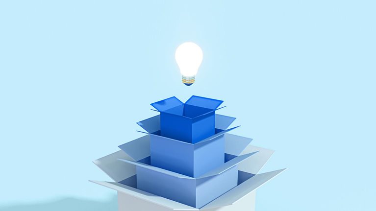 A light bulb above four open cartons
