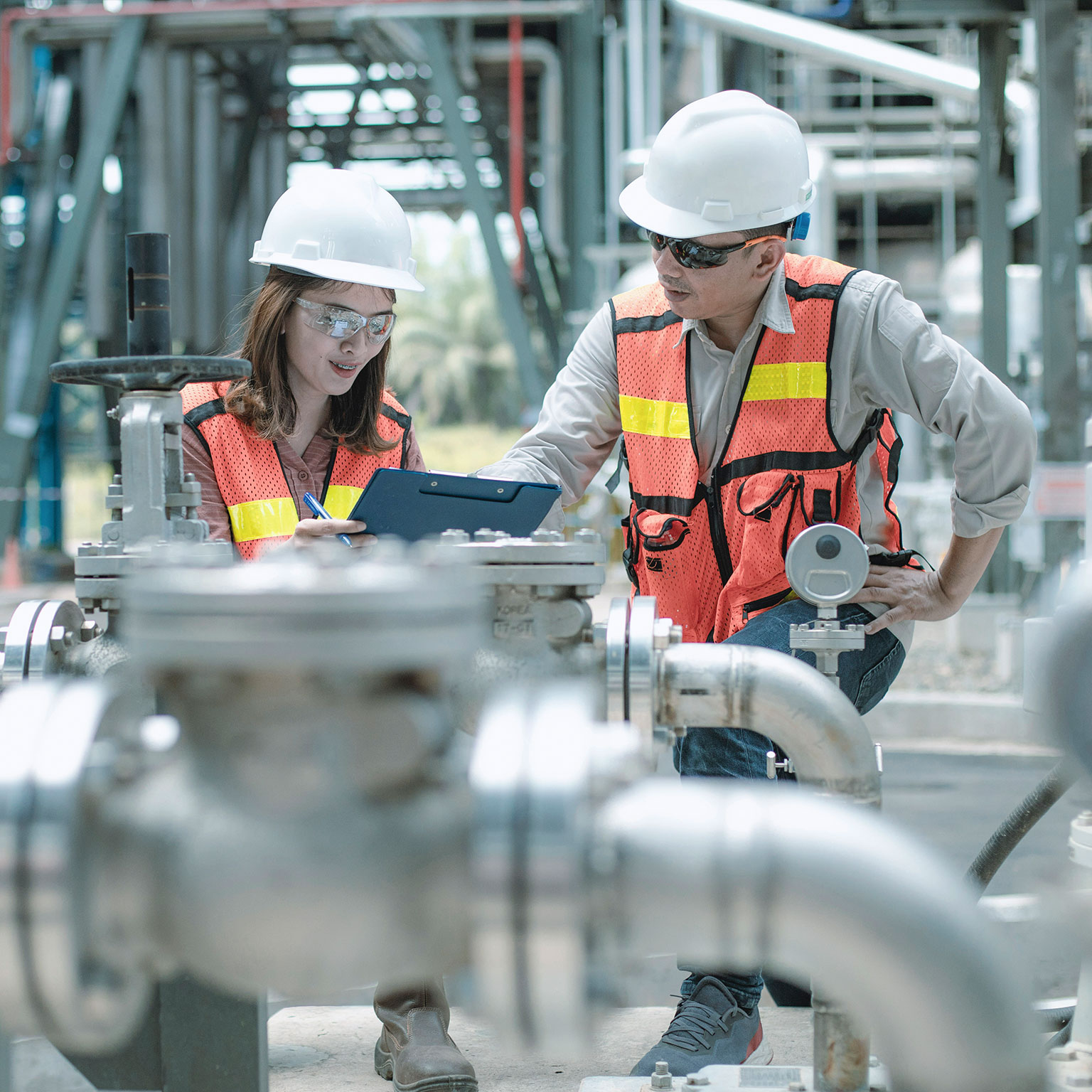 electricity engineer and his supervisor at industrial facility