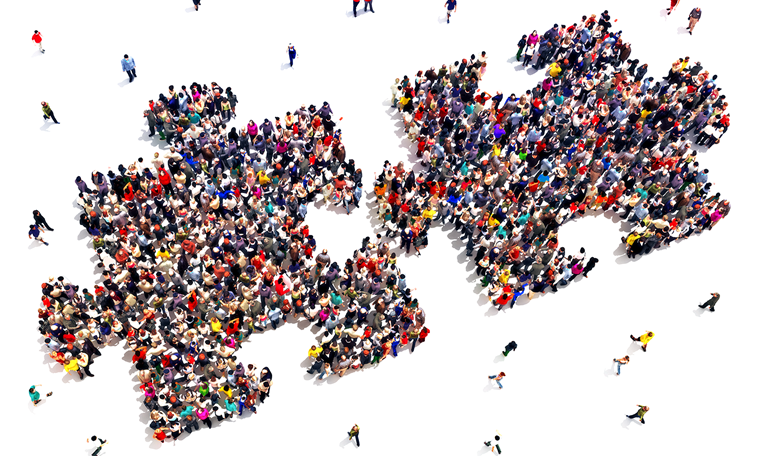 Jigsaw puzzle pieces joining to grow