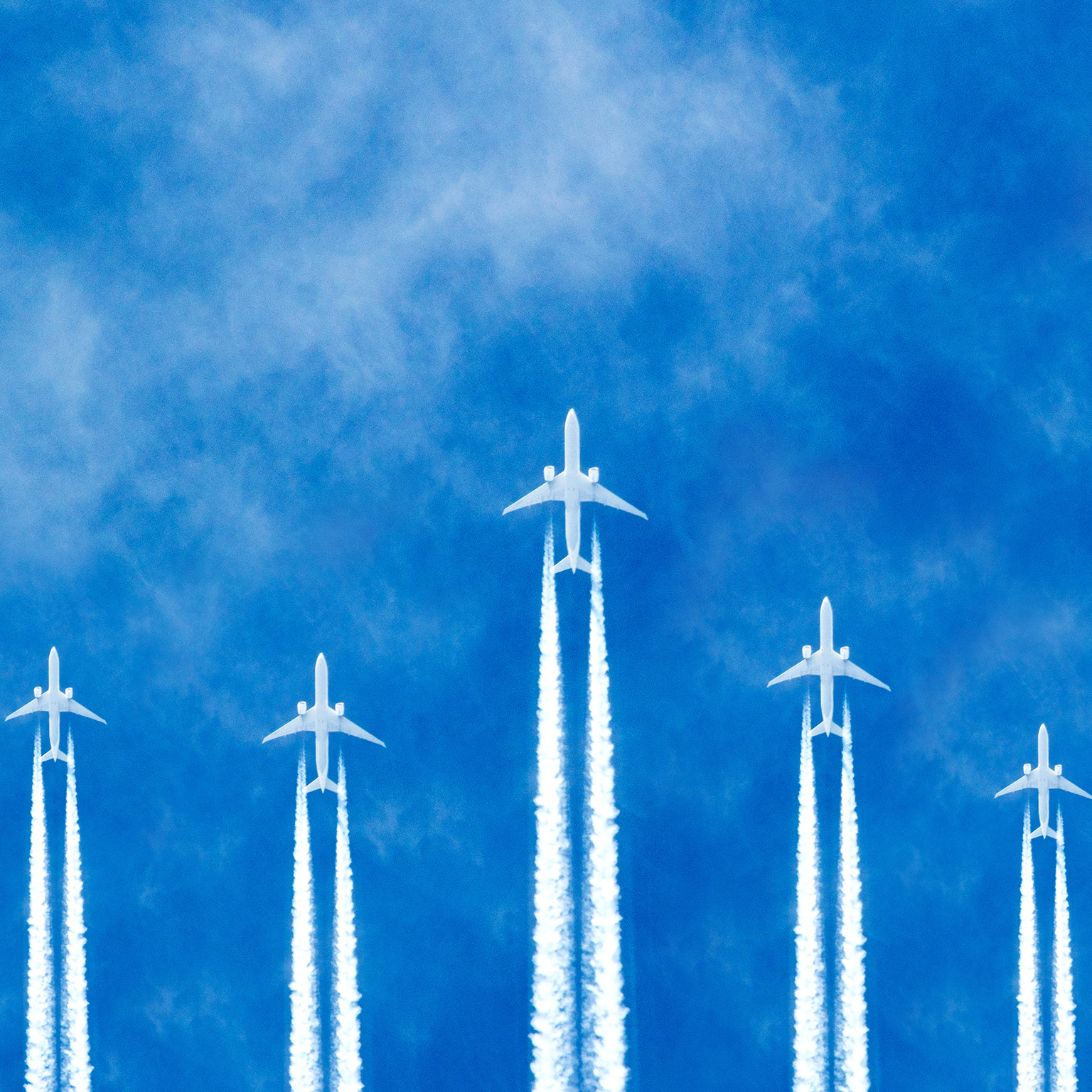 Photorealistic illustration of planes flying across the sky