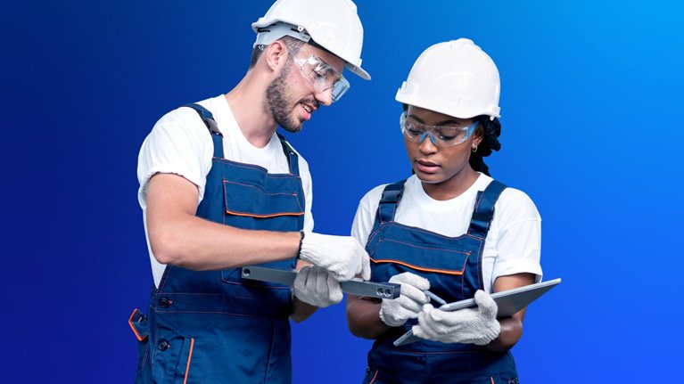 Two production operators with tablet in factory shop floor